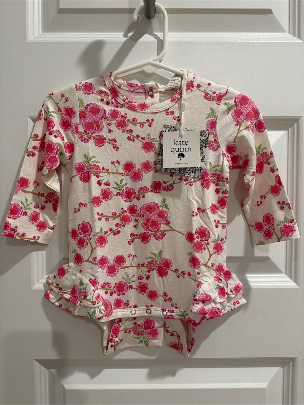 Kate Quinn Long Sleeve Double Ruffle Leg Bodysuit- Pink Cherry Blossom